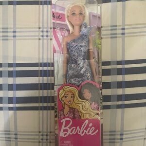 One Barbie doll in a box.